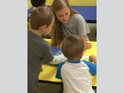 Emilienne Urgo-Dubay works with preschool students at the Teddy Bear Academy.