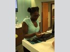 Gi’Ana Gilbert assists customers and staff with banking operations at Seacoast Bank.