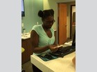 Gi’Ana Gilbert assists customers and staff with banking operations at Seacoast Bank.