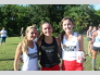 Ella Burgener, Katrina Wynne, and Gwenyth Altman prepare to show off their Clark determination at a South Fork cross country meet